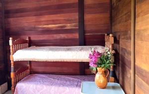 Postel nebo postele na pokoji v ubytování Chambre Maison Kumba