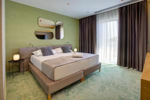 Postel nebo postele na pokoji v ubytování Hotel Experience
