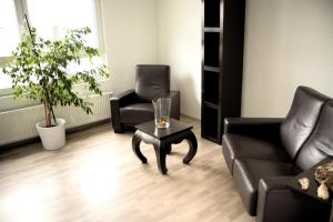 a living room with a couch and a coffee table at City Ferienwohnung Gaggenau in Gaggenau