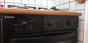 a black oven with a wooden counter top at Vacanze a Rovere in Rovere