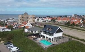 an aerial view of a house with a swimming pool at Villa Zandvoort in Zandvoort