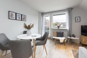 TV a/nebo společenská místnost v ubytování Appartement Nele Kieler Straße 16a APPARTO Grömitz