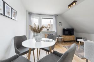 TV a/nebo společenská místnost v ubytování Appartement Nele Kieler Straße 16a APPARTO Grömitz