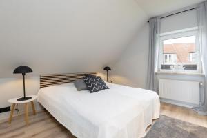 Postel nebo postele na pokoji v ubytování Appartement Nele Kieler Straße 16a APPARTO Grömitz