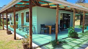 a covered patio with a table and chairs at The Dreamcatcher's View in Zuurbraak