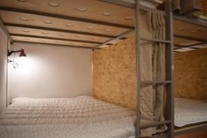 Letto o letti in una camera di SLEEP STUDIO Hostel
