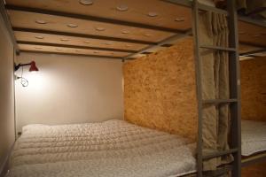 Letto o letti in una camera di SLEEP STUDIO Hostel