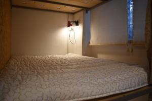 Letto o letti in una camera di SLEEP STUDIO Hostel