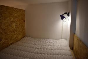 Letto o letti in una camera di SLEEP STUDIO Hostel