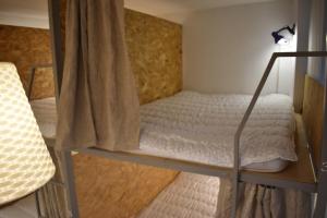 Letto o letti in una camera di SLEEP STUDIO Hostel