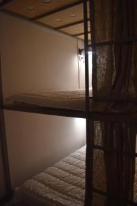 Letto o letti in una camera di SLEEP STUDIO Hostel
