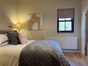 Postel nebo postele na pokoji v ubytování Cottage 474 - Kylemore