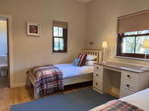 Postel nebo postele na pokoji v ubytování Cottage 474 - Kylemore