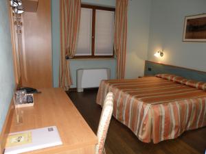 Кровать или кровати в номере Madonna della Neve