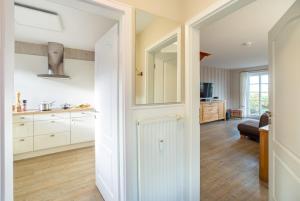 Küche/Küchenzeile in der Unterkunft Ferienwohnung Lachmöwe