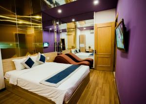 Ένα ή περισσότερα κρεβάτια σε δωμάτιο στο Mata Love hotel