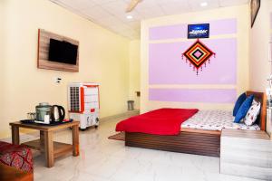 Postel nebo postele na pokoji v ubytování Samarth home stay