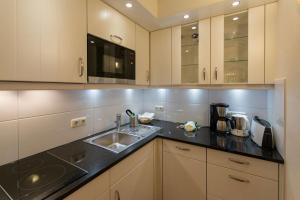 Kuchyň nebo kuchyňský kout v ubytování Haus am Park Wohnung Nr3 + 3 fotografie