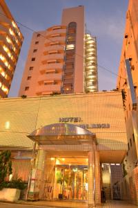 a large building with a clock on the front of it at Hotel Listel Shinjuku in Tokyo