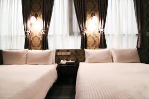 Postel nebo postele na pokoji v ubytování LIHO Hotel Hankou