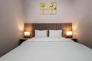 Rúm í herbergi á Horizon Hotel Yerevan