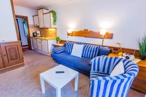 A seating area at Soldanella 4 by Alpenidyll Apartments