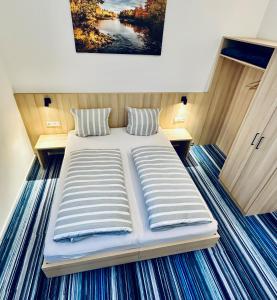 Postel nebo postele na pokoji v ubytování Hotel Lumi