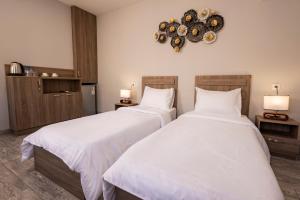 Rúm í herbergi á Horizon Hotel Yerevan
