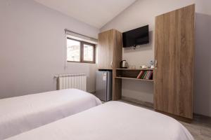 Rúm í herbergi á Horizon Hotel Yerevan