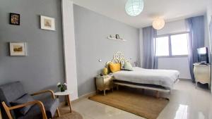 Ένα ή περισσότερα κρεβάτια σε δωμάτιο στο La Casita Suites