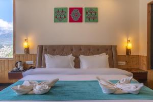 Voodi või voodid majutusasutuse Echor Himalayan Heights Manali toas