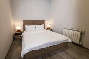 Rúm í herbergi á Horizon Hotel Yerevan