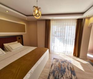 Postel nebo postele na pokoji v ubytování Toprak Apart Otel
