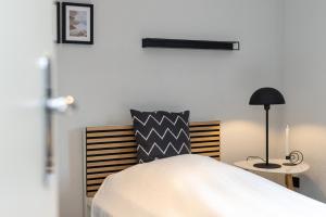 Postel nebo postele na pokoji v ubytování Appartement Merle Kieler Straße 16a APPARTO Grömitz