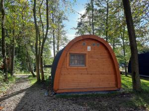a small igloo house in the woods at 25 Premium Camping Pod "Sylt" in Silberstedt