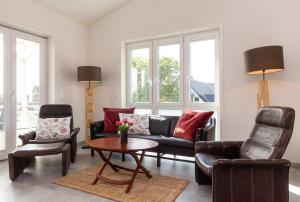 Posezení v ubytování Ferienwohnung Weiße Düne 2 + 12 fotografií