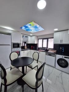 a kitchen with a table and chairs in it at Daly Resort 2 in Sapanca