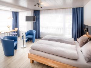 Lova arba lovos apgyvendinimo įstaigoje Hotel Alpha