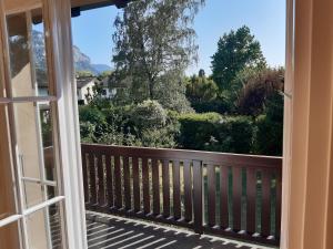 an open door to a balcony with a view at respite finaly in Geneva