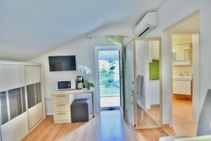 Η κουζίνα ή μικρή κουζίνα στο Apartmani Barać +24 φωτογραφίες