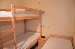 En eller flere senge i et værelse på FeWo Sandrock Nr31 Solmare