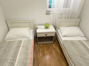 Cama ou camas em um quarto em Stara Kuća Apartments