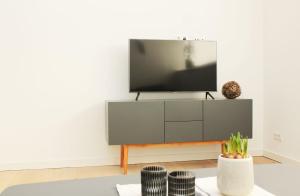 TV a/nebo společenská místnost v ubytování Ferienwohnung HeiDi Lux 1