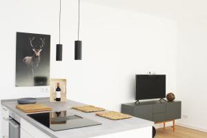 TV a/nebo společenská místnost v ubytování Ferienwohnung HeiDi Lux 1