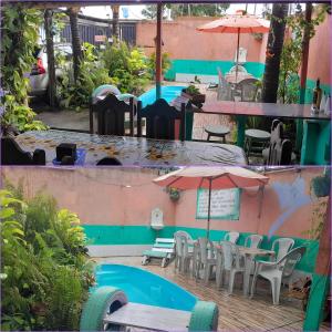 Un patio con mesas y sillas y una sombrilla. en Hospedagem Chapéu Virado, en Belém