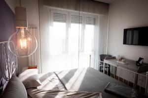 Postel nebo postele na pokoji v ubytování Da Filippo B&B