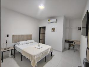 Letto o letti in una camera di Hotel Astor Cucuta