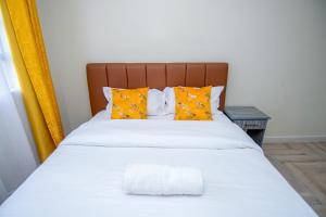 A bed or beds in a room at Blink comfort suite- Tiger