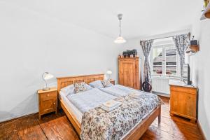 Postel nebo postele na pokoji v ubytování Apartmány Krumlov