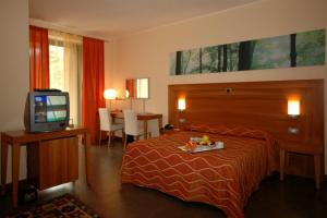 Postel nebo postele na pokoji v ubytování Hotel Langhe & Monferrato